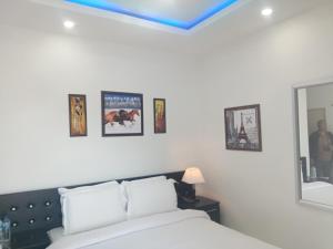 Postel nebo postele na pokoji v ubytování J. I. T HOTEL