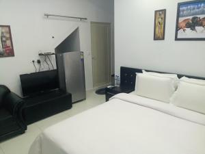 Postel nebo postele na pokoji v ubytování J. I. T HOTEL