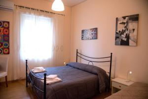 Postel nebo postele na pokoji v ubytování B&B Caffelletto - Papardo