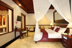 Postel nebo postele na pokoji v ubytování Bali Tropic Resort & Spa - CHSE Certified