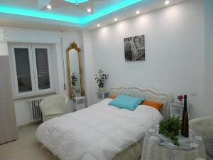 Postel nebo postele na pokoji v ubytování Monaco Rooms + 8 fotografií