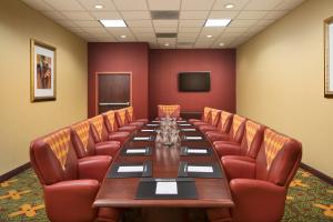 a conference room with a long table and leather chairs at University Plaza Hotel in Springfield +35 photos