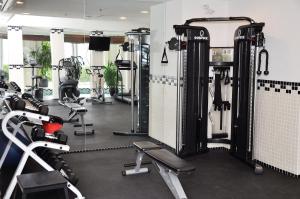 a gym with several treadmills and exercise machines at Hotel Eldorado at Eldorado Resort in Kelowna