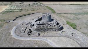 an aerial view of an ancient ruins in a field at Agriturismo Cugumia in Thiesi