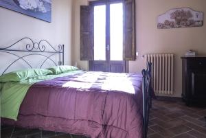 Postel nebo postele na pokoji v ubytování Residenza Frenguelli