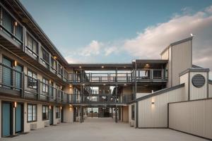 an empty courtyard of a building with balconies at Wave Street Inn in Monterey