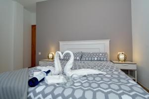 A bed or beds in a room at Apartamento El Pueblo