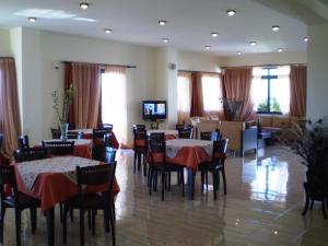 A television and/or entertainment centre at Roubini Apartments