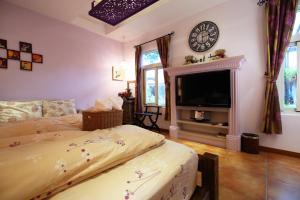 Katil atau katil-katil dalam bilik di Jasmine Orange B&B