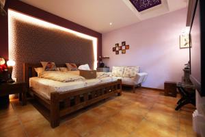 Katil atau katil-katil dalam bilik di Jasmine Orange B&B