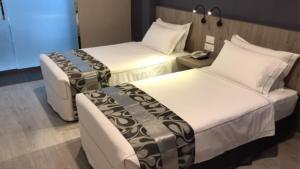 Postel nebo postele na pokoji v ubytování Diamond Inn