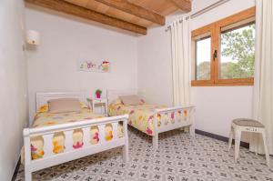 Posteľ alebo postele v izbe v ubytovaní Can Xesquet (Pleta Morell)