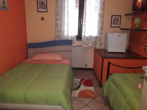 Postel nebo postele na pokoji v ubytování Le 3 Camelie Malpensa