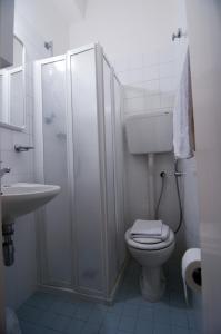 Koupelna v ubytování Hotel Savina + 37 fotografií