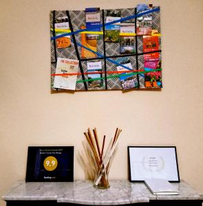 a painting hanging on a wall above a table at Modern Family Flat Málaga in Málaga