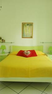Una cama o camas en una habitación de Il Cortile