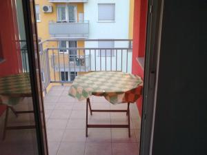 a table and chairs sitting on a balcony at Arena Jaruščica Apartment in Zagreb