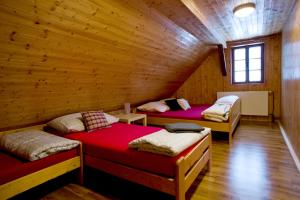 Postel nebo postele na pokoji v ubytování Sauna Cottage BedRich