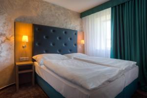 Postelja oz. postelje v sobi nastanitve Hotel Galatea