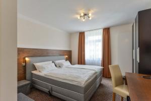 En eller flere senge i et værelse på Hotel PrimaVera parco