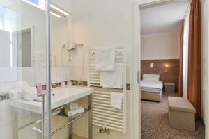 Postel nebo postele na pokoji v ubytování Hotel PrimaVera parco