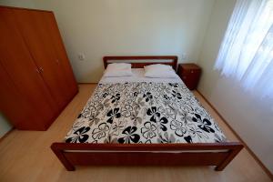 Ein Bett oder Betten in einem Zimmer der Unterkunft Apartment Kod Stipe