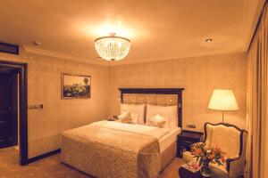 Uma cama ou camas num quarto em Hotel Florian Palace