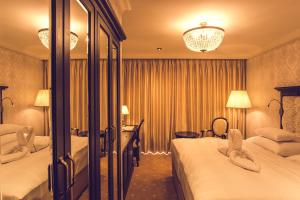 Uma cama ou camas num quarto em Hotel Florian Palace