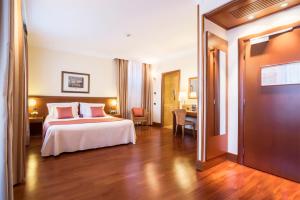 Postel nebo postele na pokoji v ubytování Hotel Ponte Sisto