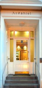 a front door of a building with a staircase in front at Ardshiel Hotel in Campbeltown