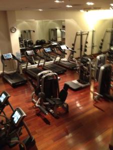 a gym with a bunch of treadms and machines at Patio Mare in Sopot