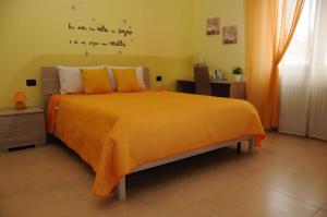 A bed or beds in a room at Color House Malpensa B&B