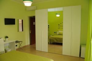 A bed or beds in a room at Color House Malpensa B&B