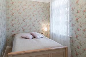 Postel nebo postele na pokoji v ubytování Allika Apartments