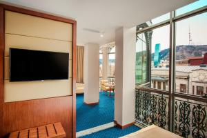 TV a/nebo společenská místnost v ubytování New Tiflis Hotel