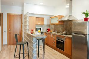 A cozinha ou cozinha compacta de MH Apartments S. Familia