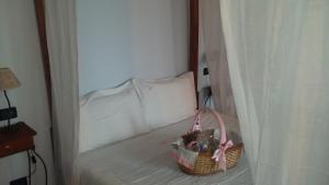 Postel nebo postele na pokoji v ubytování Corte Stellata Holiday Apartments