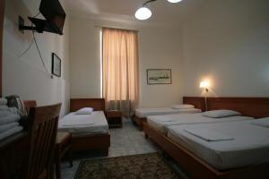 Posteľ alebo postele v izbe v ubytovaní Lena Hotel