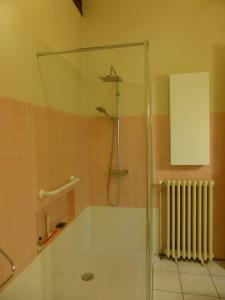 a shower with a glass door in a bathroom at Michelet in Collioure +37 photos
