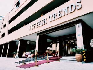 a building with a sign on the front of it at Juffair Trends Luxury Apartment in Juffair