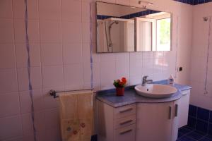 a bathroom with a sink and a mirror at Le Case dei Pescatori - Villa Domitilla in Ponza +59 photos