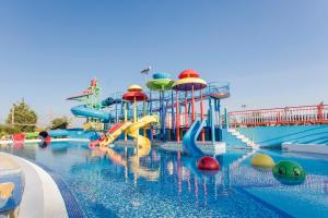 a pool with a water park with a water slide at Alfagar Alto da Colina in Albufeira