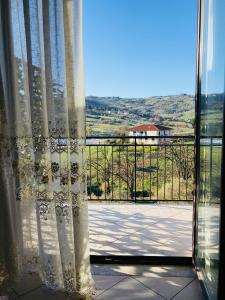 a window with a view of a tennis court at B&B Damiani in Santa Maria di Castellabate