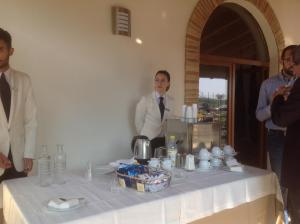 a group of men standing next to a table with a table at Casetta Don Carlino in Campomarino