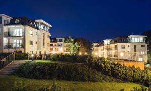 a row of apartment buildings at night at Apartament Aquarius Sopot in Sopot