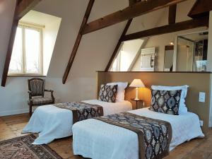 Letto o letti in una camera di Manoir de Kergrec'h