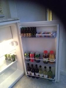 an open refrigerator filled with lots of drinks at City Apartment in Aarhus
