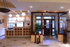 a lobby with a glass door in a building at Anesis Hotel in Kalavrita