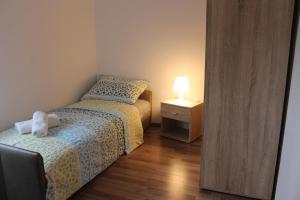 Postel nebo postele na pokoji v ubytování Apartments Anicic Coric