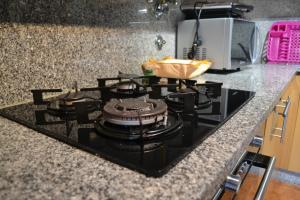 a black stove top oven in a kitchen at Casa D'avo in Geres